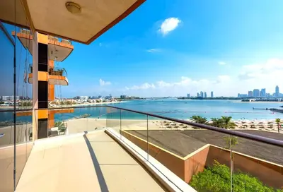 a view of the ocean from the balcony of a building at Tiara Residence, The Palm - Elegant 1BR with Full Sea View in Dubai