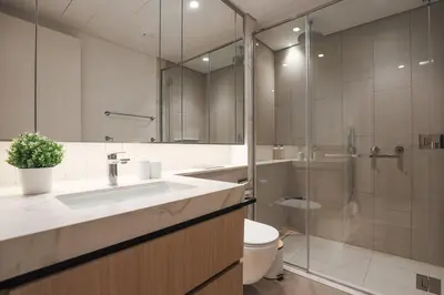 a bathroom with a sink and a shower and a toilet at Stylish Studio at Berkeley Place by Ellington in Dubai