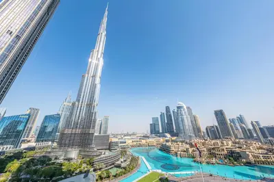 a view of the skyscrapers of a city at Full Burj Khalifa and Fountain View from All Rooms in Dubai