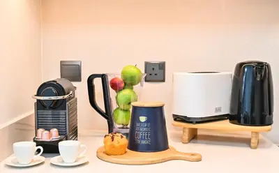 a kitchen counter with a coffee maker and a coffee maker at Majestic Act2 1BR Dowtown Dubai in Dubai