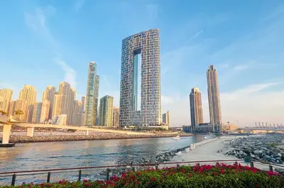 a view of a city with tall buildings and a river at Livbnb Beachfront 2BR in Address JBR Sea & Ain Dubai Views in Dubai