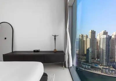 a room with a window with a view of a city at Novity Signature Homes in Dubai