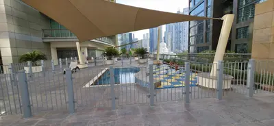 a pool in the middle of a building at Trendy & Cozy Getaway in Dubai