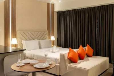 a hotel room with a bed and a couch at Trendy & Cozy Getaway in Dubai