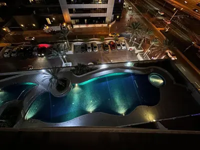 an overhead view of a swimming pool at night at DREAM by Design Studio in Dubai