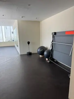 an empty room with a gym with two exercise balls at Affordable master bedroom hotel apartment in Dubai