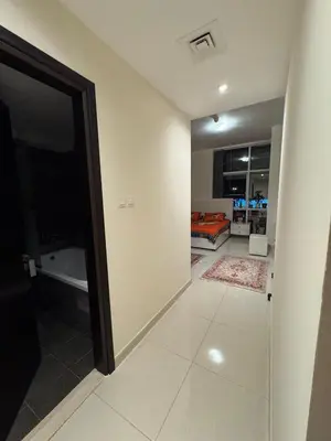 a room with a door leading to a bedroom at Stylish 2BHK in Prime Location in Dubai