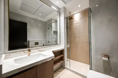 a bathroom with a sink and a shower at Luxury 3BR Full Burj Khalifa View Stay by World's Tallest Tower in Dubai