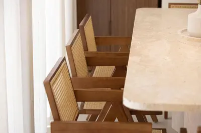 a table with two chairs next to a marble counter at Seraya at Residence 110 in Dubai