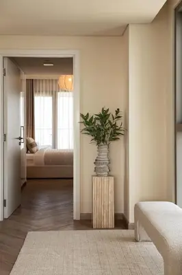 a room with a vase with a plant in it at Seraya Residence 9 - 4BDR - Skyline and Burj View - 3 Balconies in Dubai