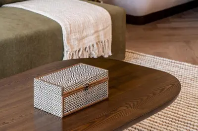 a box sitting on top of a wooden table at Seraya Residences at Forte in Dubai