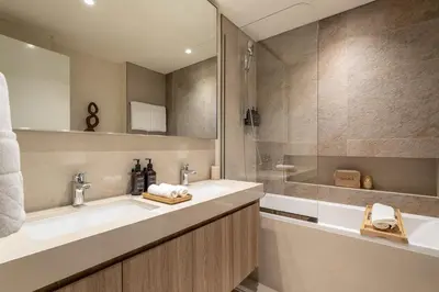 a bathroom with a sink and a shower at Seraya Residences at Downtown Views 2 in Dubai