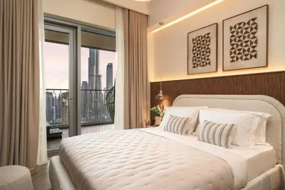 a bedroom with a large bed and a large window at Seraya Residence 12 - 3BDR - Hot Tub on patio with Burj view in Dubai