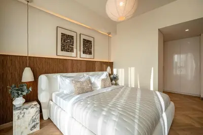 a bedroom with a large white bed in it at Seraya Residence 12 - 3BDR - Hot Tub on patio with Burj view in Dubai