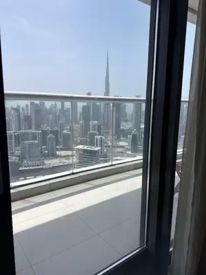 a view of a city skyline from a window at Royal Montania by DAMAC Paramount , Burj Khalifa View in Dubai