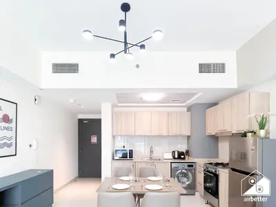 a kitchen with a table and chairs in a room at Amazing Stay in AG Tower , Business bay in Dubai