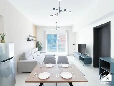 a living room with a table and a couch at Amazing Stay in AG Tower , Business bay in Dubai
