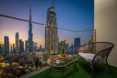 a balcony with a view of a city skyline at Skyline Gem Full Burj View 2BR Suite with Dubai Mall access by Maxx Value homes in Dubai