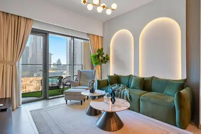 a living room with a couch and a table at Skyline Gem Full Burj View 2BR Suite with Dubai Mall access by Maxx Value homes in Dubai
