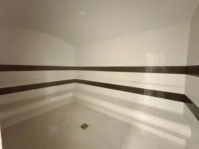 an empty room with black and white stripes on the wall at Dubai Studio Retreat Pool, Gym, Balcony & Queen Bed for Two in Dubai
