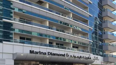a large building with the name marina element at Stylish 1BHK Balcony with Canal View Near Shoba Metro Station in Dubai