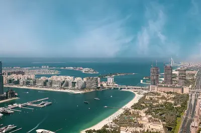 an aerial view of a city with a river and buildings at Zen Den - Vintage Charm with full Sea View in Dubai