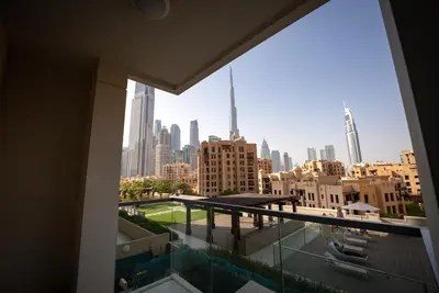 a view of a city skyline from a balcony at Luxury 2bdr apartment with Burj views & resort amenities in Dubai