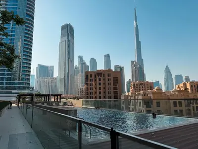 a view of a city skyline with a pool at Luxury 2bdr apartment with Burj views & resort amenities in Dubai