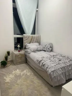 a small bedroom with a bed and a window at Pinnacle marina in Dubai