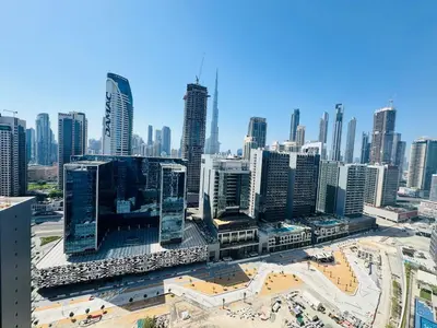 an aerial view of a city with tall buildings at Burj Khalifa Skyline View in Dubai