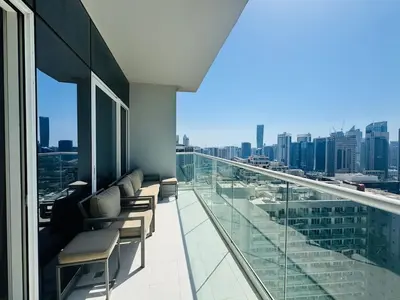 a balcony of a building with a view of a city at Burj Khalifa Skyline View in Dubai