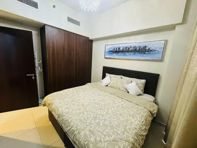 a bedroom with a large bed in a room at Burj Khalifa Skyline View in Dubai
