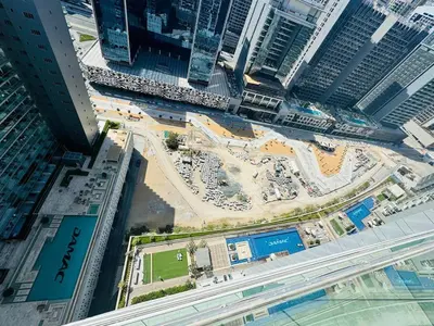 an aerial view of a city with tall buildings at Burj Khalifa Skyline View in Dubai