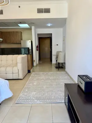 a living room with a white couch and a table at Luxury 1BR studio with Scenic view near Dubai mall in Dubai