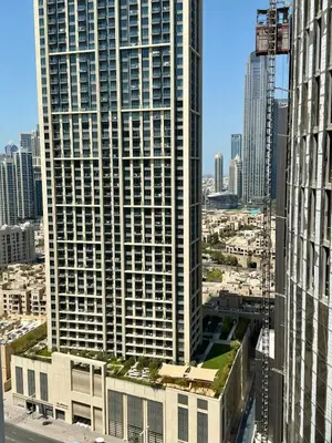 a view of a tall building in a city at Luxury 1BR studio with Scenic view near Dubai mall in Dubai
