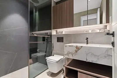 a bathroom with a sink and a toilet at Chic Studio in Arjan with Gym Pool Free parking in Dubai