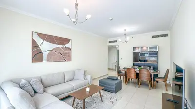 a living room with a couch and a table at Relaxing Marina View Stay, Walk to Beach & Mall - 27AB02 in Dubai