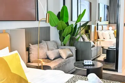 a living room with a couch and a table at Luxury Studio mints Walk to Dubai Mall & Burj Khalifa in Dubai