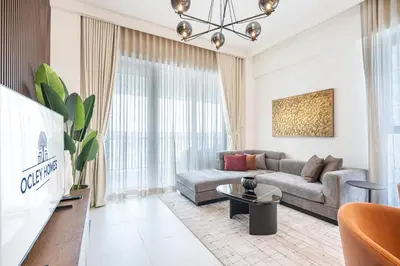 a living room with a couch and a table at Premium Home in Creek Beach with Lagoon Access in Dubai