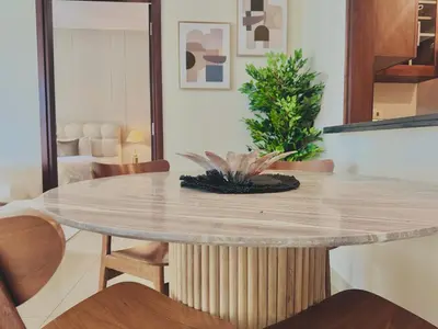 a dining room with a table and chairs at Venduras- Chic 1BR Getaway near Burj Khalifa in Dubai