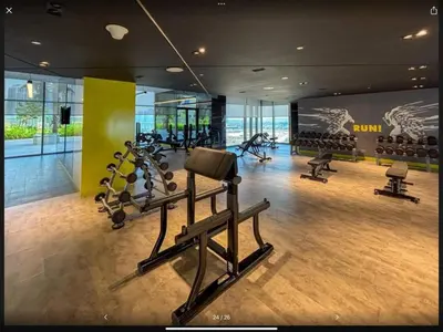 a gym with treadmills and ellipticals in a building at Samani vacation homes 3108 canal view in Dubai