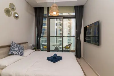a bedroom with a bed with a blue bowl on it at Samani vacation homes 4906 canal view in Dubai