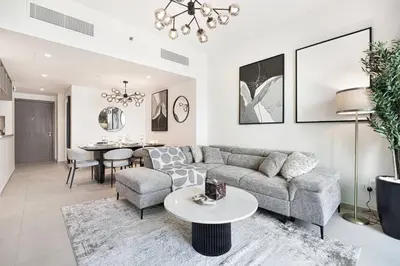a living room with a couch and a table at Mahogany 14 - 2BR Dubai Mall Walk & Burj Khalifa in Dubai