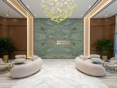 a lobby with chairs and tables and a chandelier at Opulent Nook 1br Designer Hideaway In Onyx in Dubai