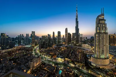 a view of a large city at night at Downtown Dubai 3BR Burj Royale in Dubai