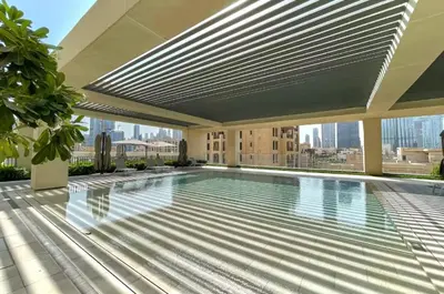 a swimming pool on the roof of a building at Downtown Dubai 3BR Burj Royale in Dubai