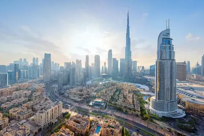 an aerial view of a city with a tall skyscraper at Downtown Dubai 3BR Burj Royale in Dubai