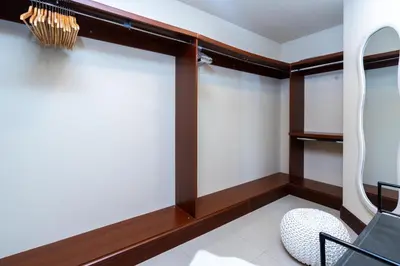a room with windows and a chair at Golden Mile at its Best 2BR Plus Maids Palm Jumeirah in Dubai