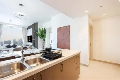 a kitchen with a sink and a counter top at Upgraded 3BR plus Maid's near Burj Khalifa & Dubai Opera in Dubai