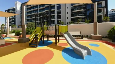 a playground with a slide at TRPS - Azizi Riviera 23, Al Meydan - Contemporary Studio in the Heart of Dubai in Dubai